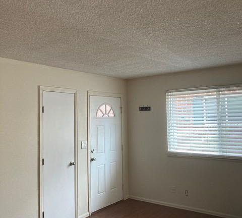 Front Door into living room and garage door.