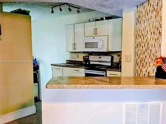 5th image of 8801 Wiles Rd APT 208