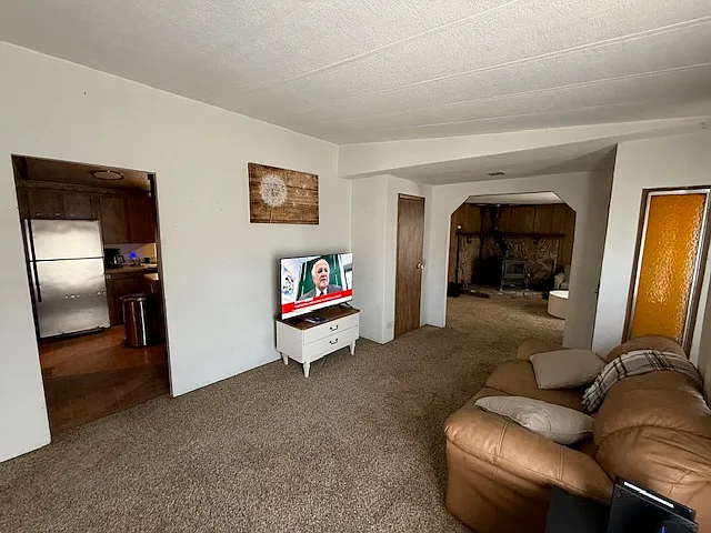 View of kitchen on left and family room on right from the living room.