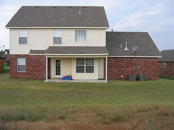 Back view shows covered patio.