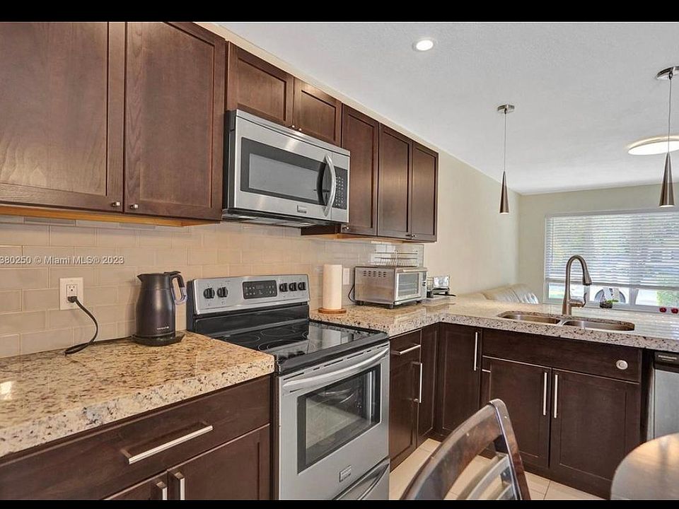 granite countertop, SS appliances and plenty of cabinets