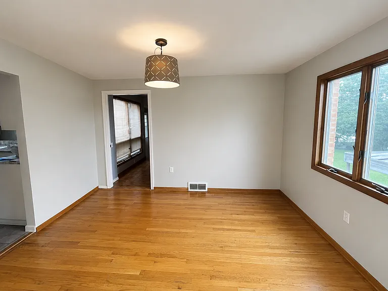 Dining room with wide doorway to accessible suite in rear of house.