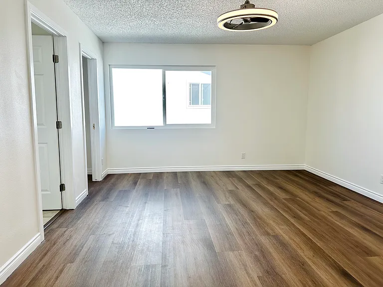 Primary master bedroom on second floor with walk-in closet and private bathroom