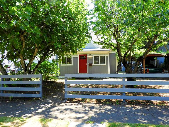 Exterior of home, surrounded by fruit trees