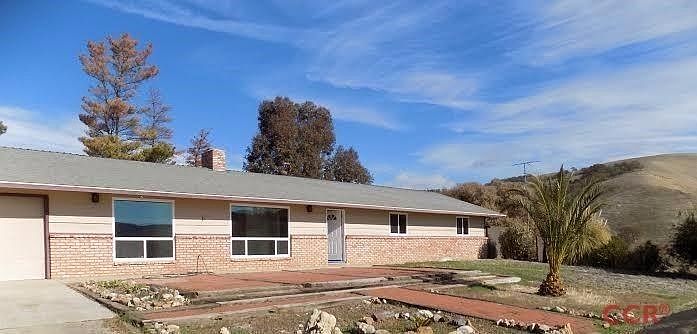 Front of this ranch style country home on 10 acres. Nice new windows all around and the front room has extra UV protection. The views are endless from everywhere up here. The front of the house faces south and the barn is just down a short slope.