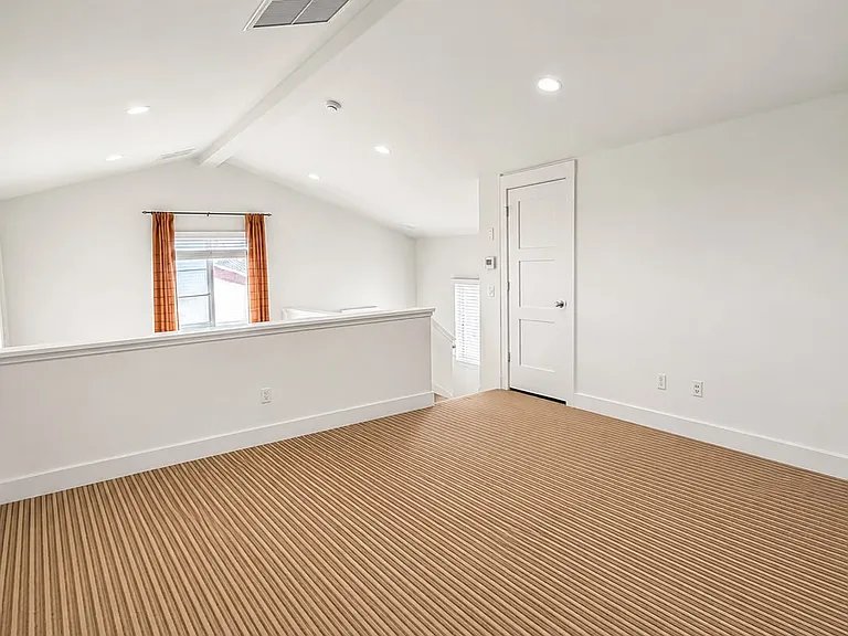 Massive top-floor entertainment room ideal for a home theater, game room, fitness area, or media lounge