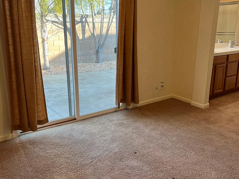 Master bedroom with sliding glass door