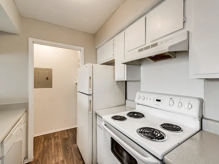 A bright kitchen with full size washer and dryer connections.