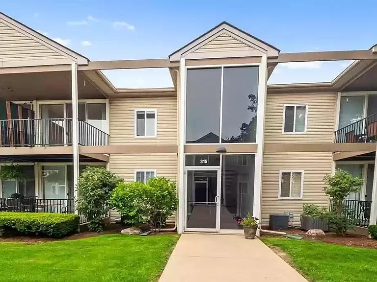 Entry door and large unit patio balcony (upper left corner)