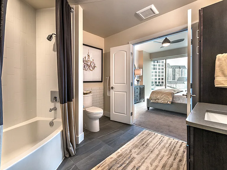 Bathroom with soaking tub and tile flooring