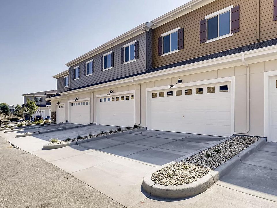 2 car garage and 2 car driveway. Stock picture, not of our actual row but all townhomes in the community have the same driveway concept.