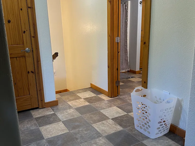 Master bedroom entry to the bathroom and stairway to main floor.