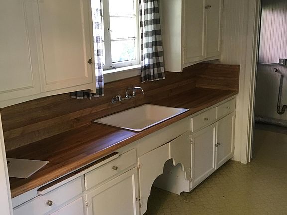 Kitchen view toward utility room entry