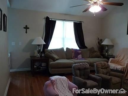 Living Room with double window!
						:
						Notice the REAL hardwood floors!