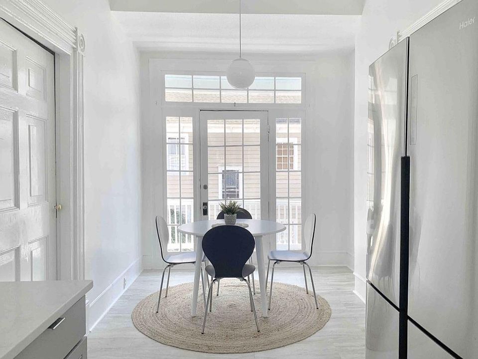 Newly renovated kitche with stai less steel appliances and marble counters and dining area.
