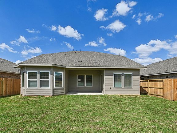 The backyard of a home in Stewart s Ranch in Conroe, TX.
