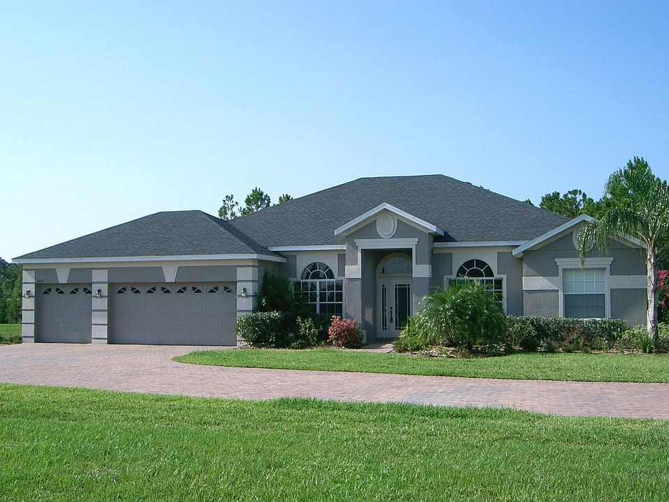 Exterior front with long paver driveway