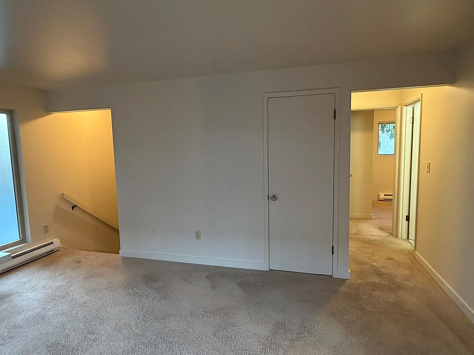 Living Room - front door staircase to the left, hallway to bath/bedrooms on right