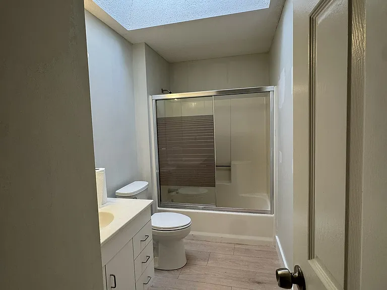 Full bathroom with huge skylight (1/2).