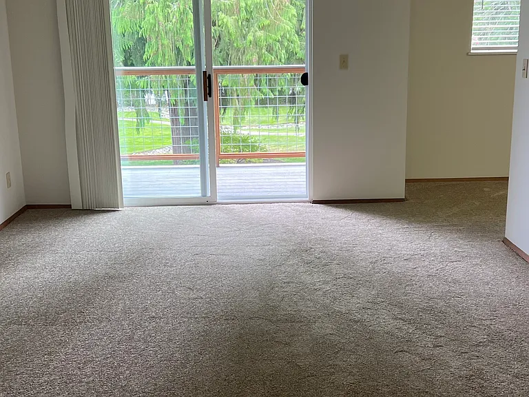 Living room with slider onto Private Deck