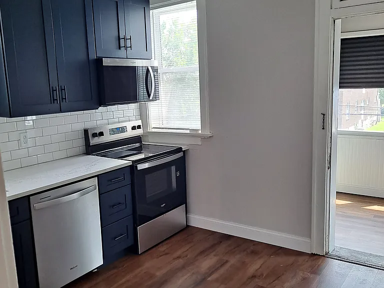 Access off kitchen to bonus room at the back of the unit.