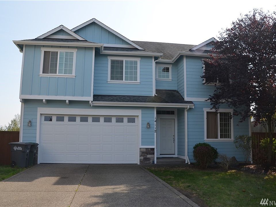 Nice front yard with extended driveway parking area.  Up to 4 card deep