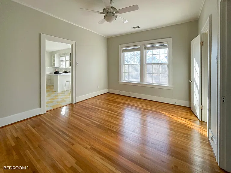 Bedroom with closet and ceiling fan.