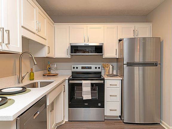 Kitchen with quartz counters, stainless appliances, and modern cabinetry