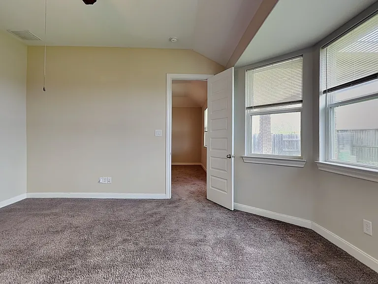 Spacious bedroom with neutral
