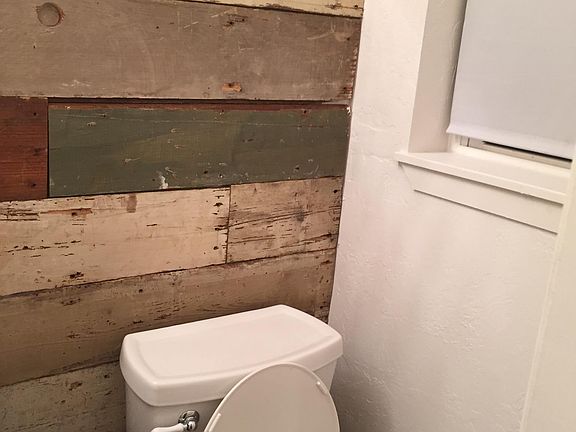 Shiplap decor on bathroom wall