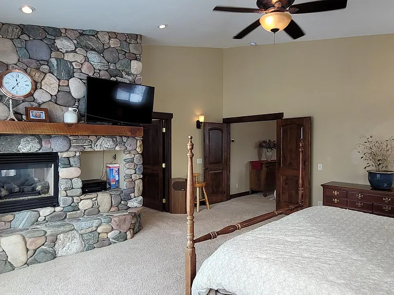 Master Bedroom, Deck, Huge Slider, Fireplace, Vaulted Celling, Double Door.