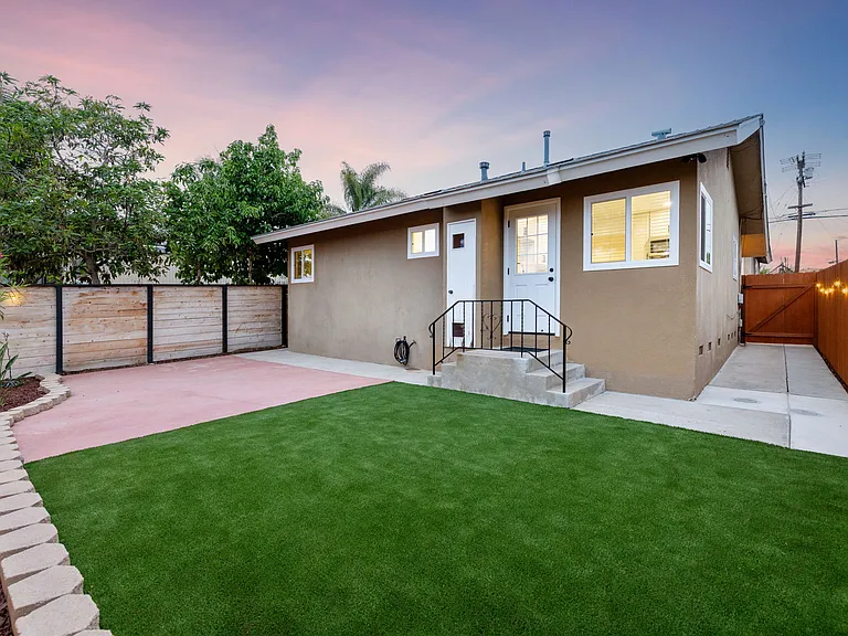 Enjoy seamless indoor-outdoor living with a kitchen that opens directly to the backyard, perfect for relaxing evenings.
