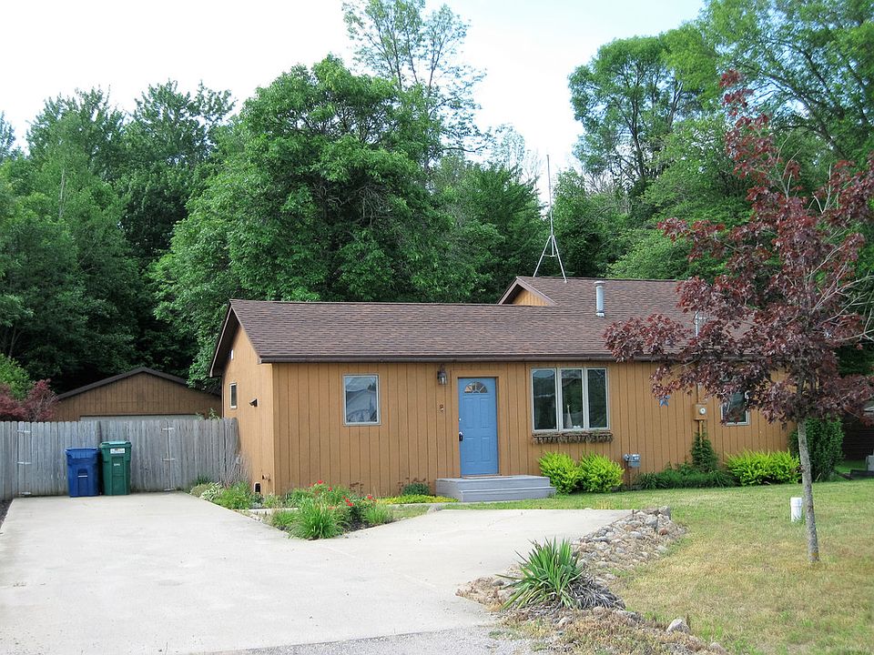 Adorable updated home across from Wixom Lake access site, beautifully maintained. White kitchen cabinets,new counter tops, stainless steel appliances, island eating area with stools, wood flooring and fresh paint. Dramatic vaulted ceilings with accent color detail are in the living room and kitchen. The dining room has a bow window to view out to the front yard and a lake view. There is one large ceramic  bath, ceramic hallway and 2 ceramic bedrooms for easy maintenance. The master bedroom has carpet and a wall of closet space. The  block half basement has the laundry area, high efficient furnace and controls for the gas generator. Seller had installed a new well recently.  Enjoy the large fenced yard and  deck off the living room with a  2.5 car garage to store your toys behind the house.    Cement driveway  has  'y' in front for plenty of parking. A perfect home for your vacation cottage or year round fun. LAKE LIVING AT A VERY REASONABLE PRICE. .