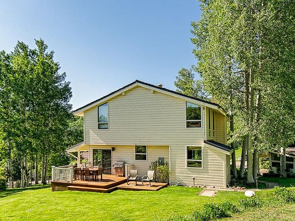 Back of Home with large Patio and ample flat yard for kids