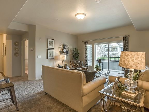 Model Living Room with Balcony View