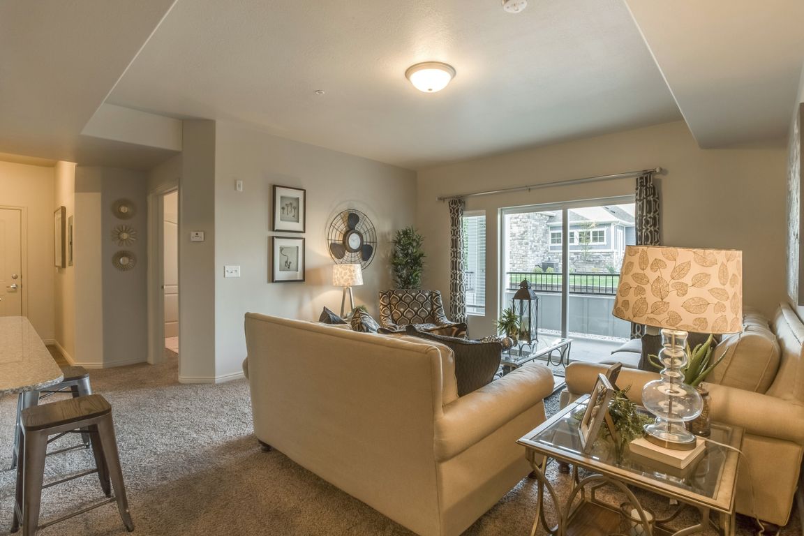 Model Living Room with Balcony View