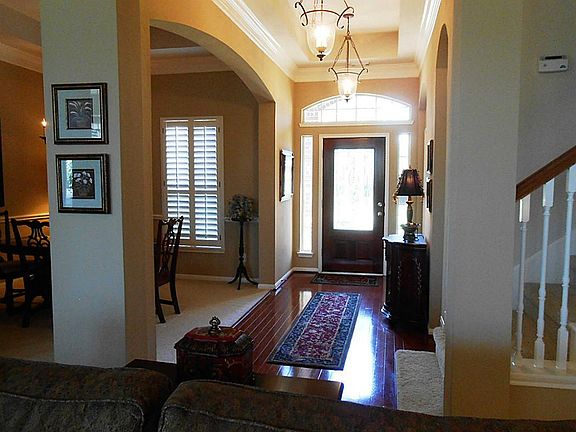 Beautiful open entry opening to the dining room, kitchen, and family room. Wood floors, trey ceiling
