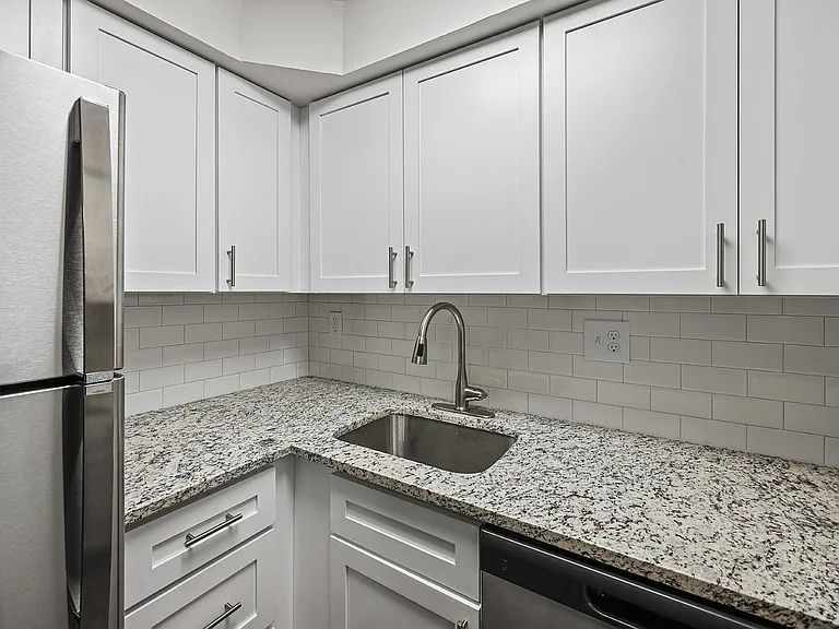Experience culinary excellence in this sleek, modern kitchen.