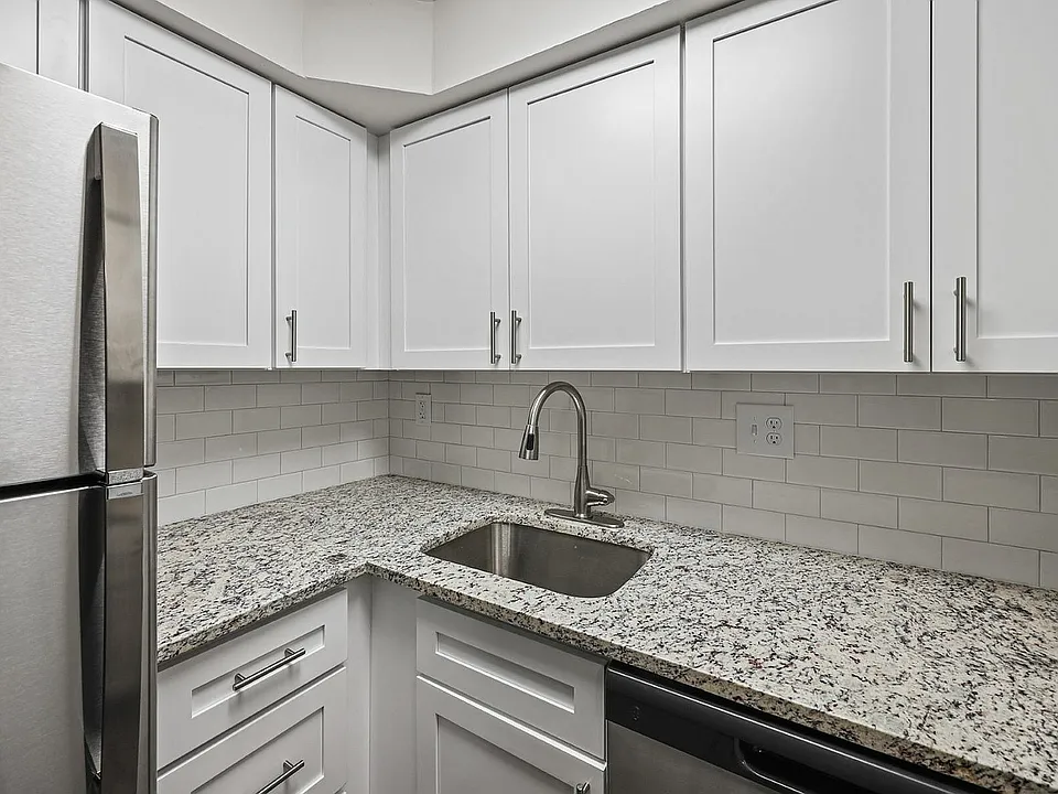 Experience culinary excellence in this sleek, modern kitchen.
