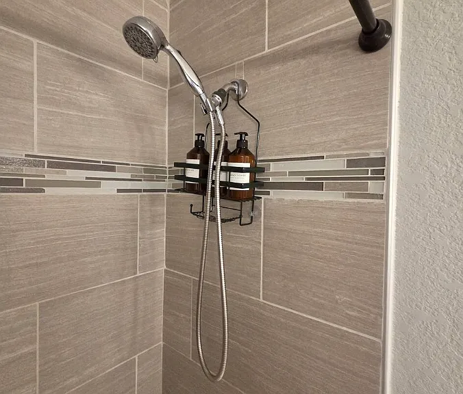 Primary en-suite bathroom with 2 vanity sinks.
