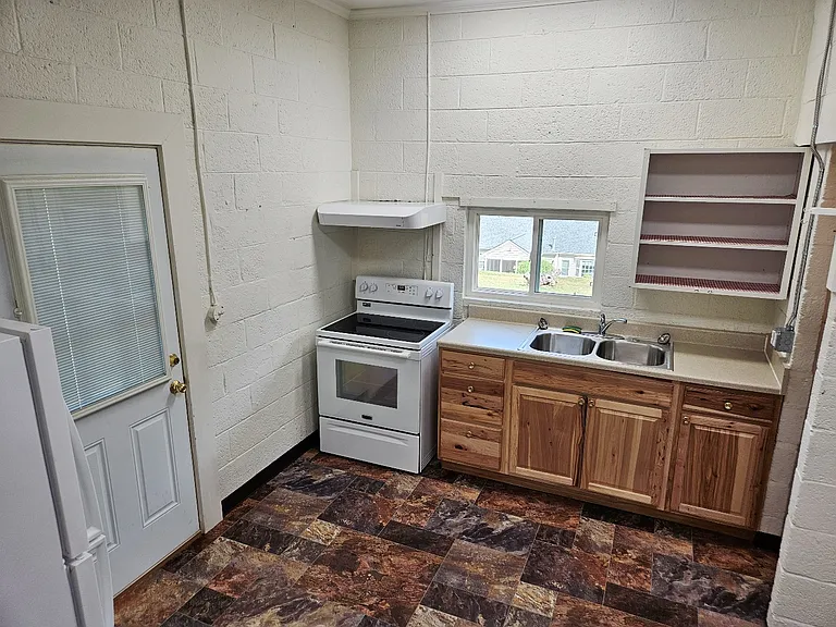 Kitche walks out to the side yard