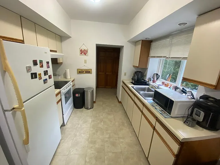 Kitchen with fridge and less than 1 year old stove!