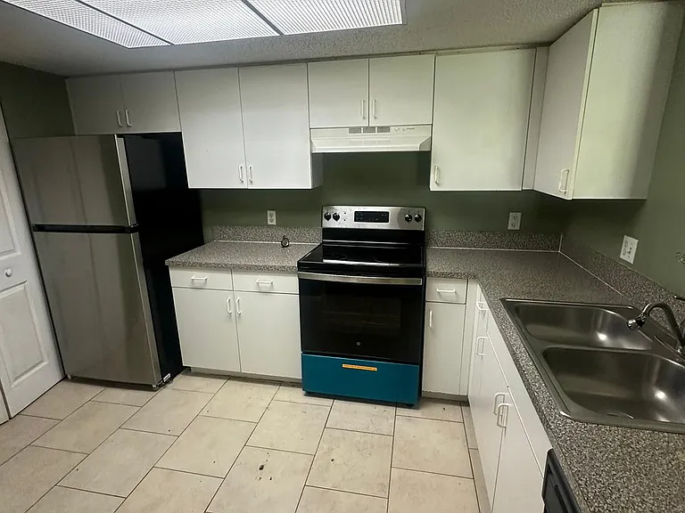 5005 Wiles Rd #102 — Photo 40
