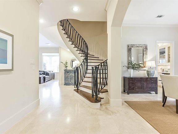 Graceful stairwell with contemporary balustrades and hardwood treads
