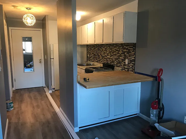 Refrigerator and sink faucet is now replaced with with stainless steel refrigerator and pull out sink faucet.