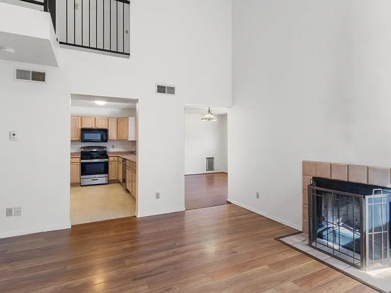 living room with kitchen and dining view