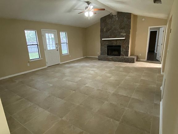 LARGE FAMILY ROOM WITH NEW TILE AND FIRE PLACE
