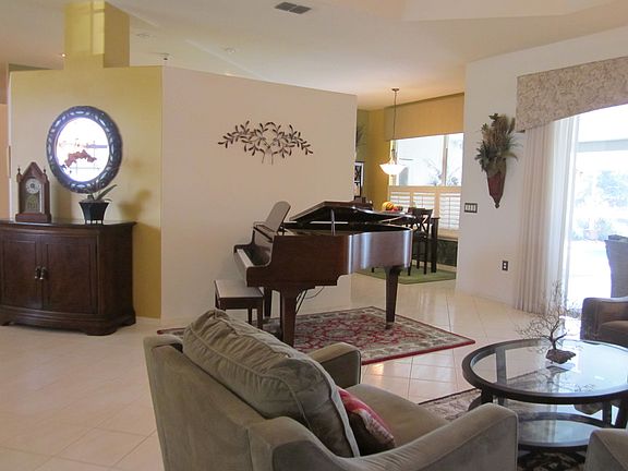 The large living room accomodates a grand piano and full sitting area.