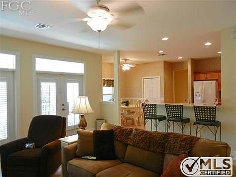 Open floor plan with great room adjacent to breakfast bar and kitchen.