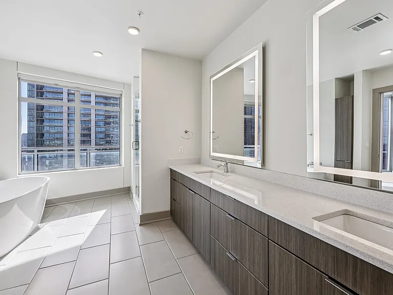 Dual Vanity Sinks with LED Mirrors and Free Standing Tubs